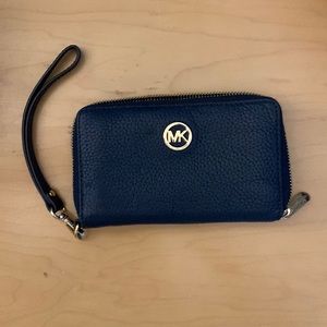 Micheal kors navy wristlet! Gold hardware.